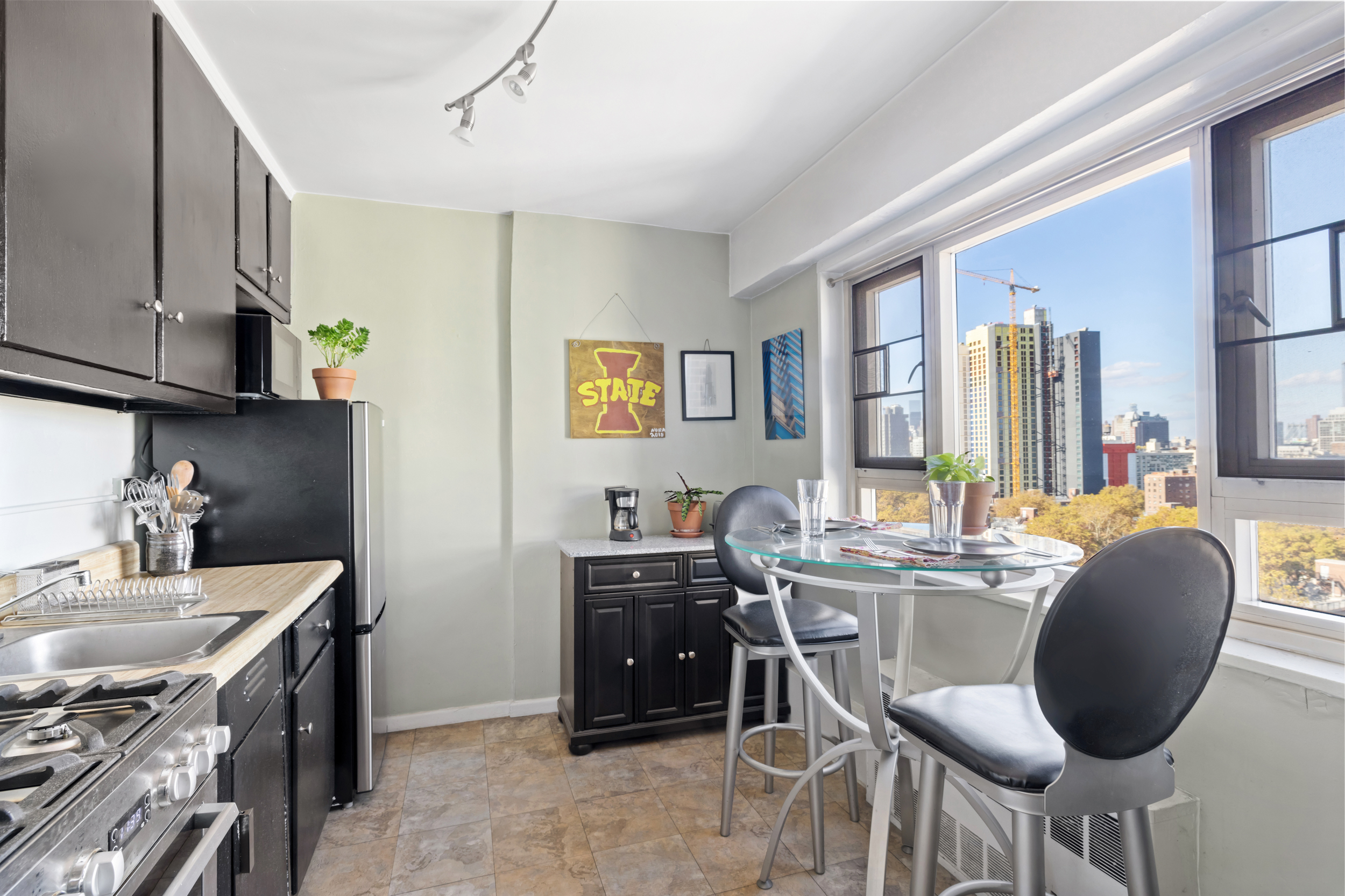 105 Ashland Place, Unit 16E Brooklyn, NY 11201 - Photo 4 of 7 a dining room with furniture and window
