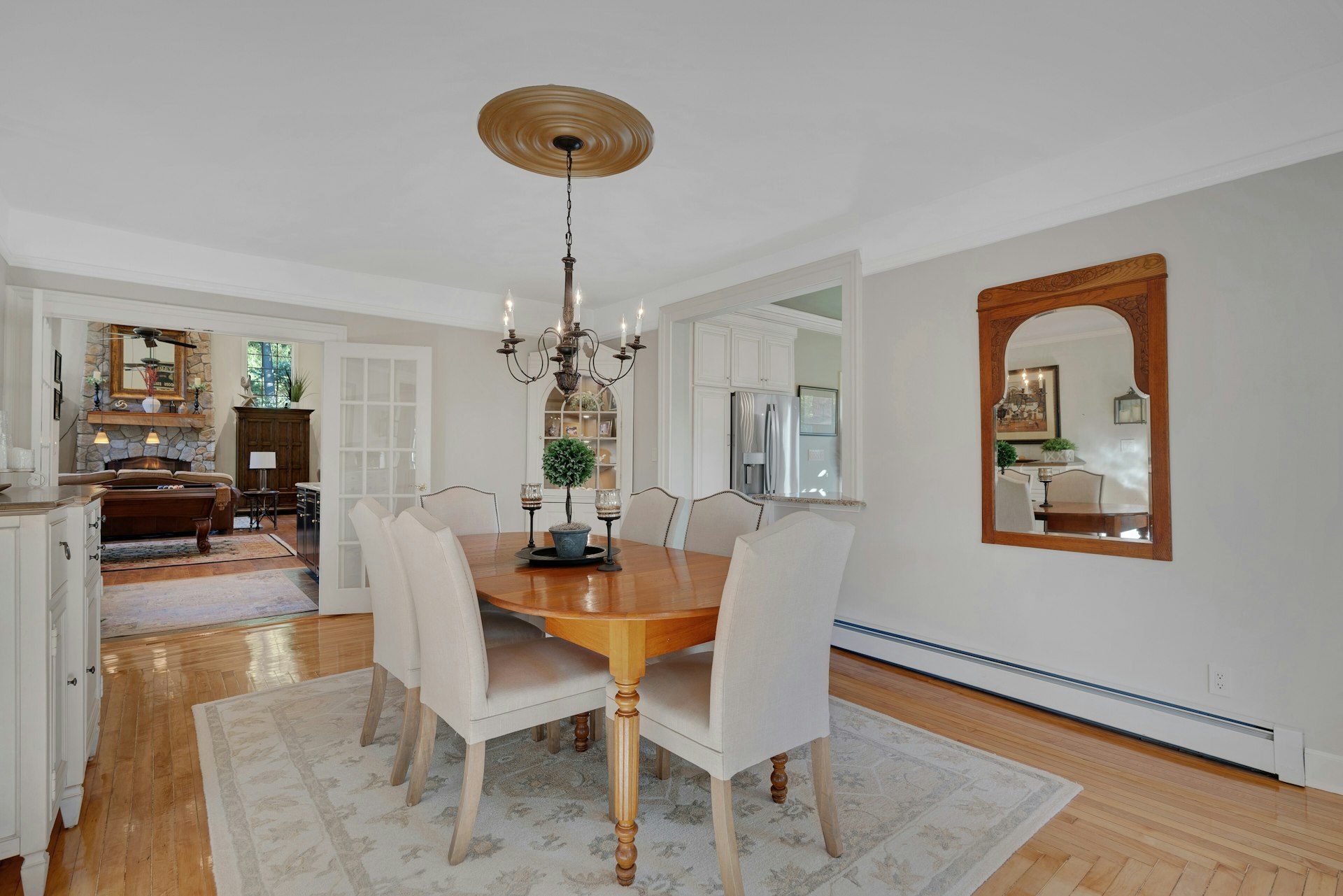 29 Evergreen Lane Watchung, NJ 07069 - Photo 22 of 54 a dining room with furniture a chandelier and wooden floor