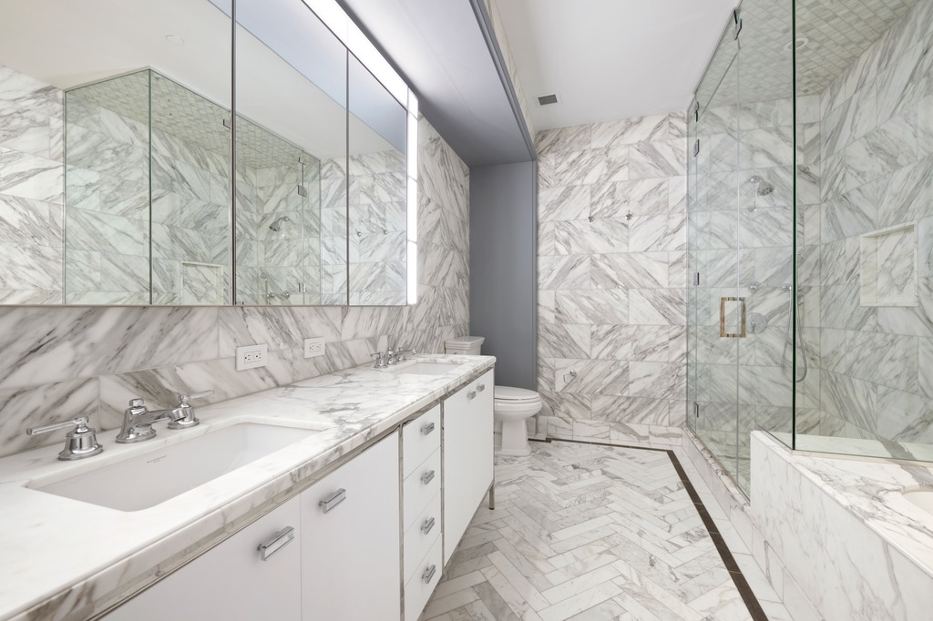 100 Barclay Street, Unit 13K Manhattan, NY 10007 - Photo 11 of 27 a bathroom with a sink and a bathtub