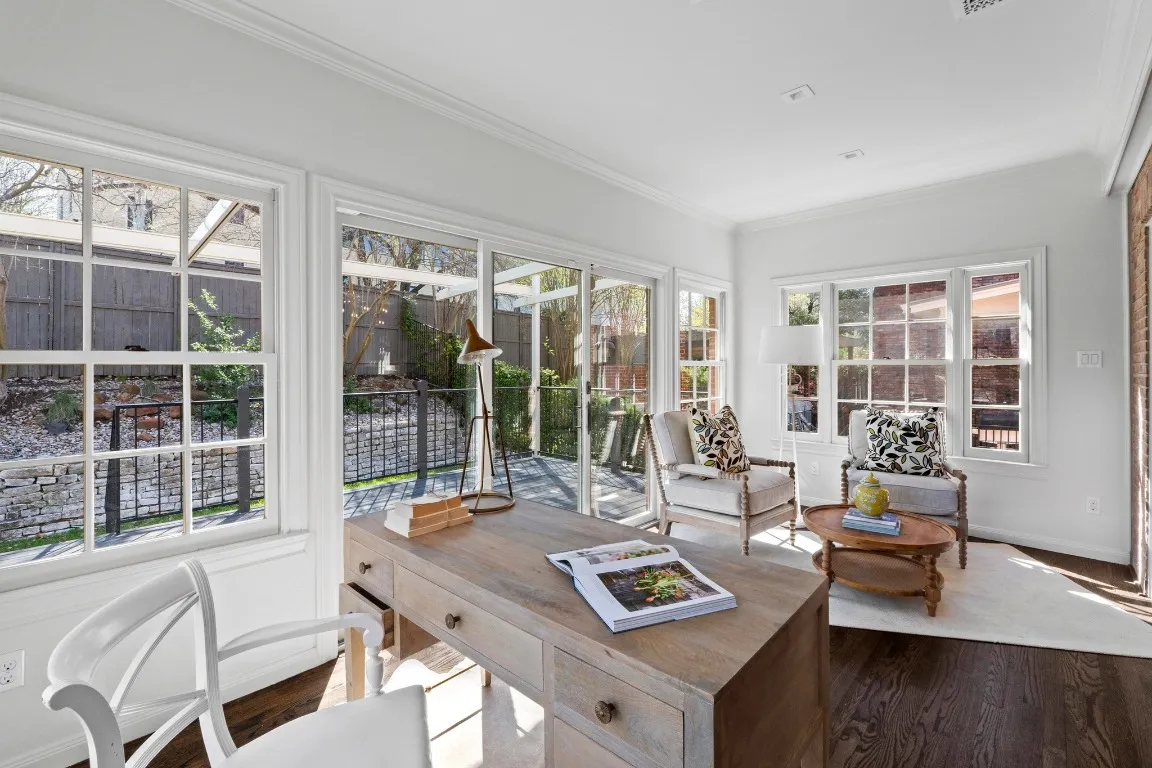 a kitchen with stainless steel appliances granite countertop a refrigerator a sink a stove and white cabinets