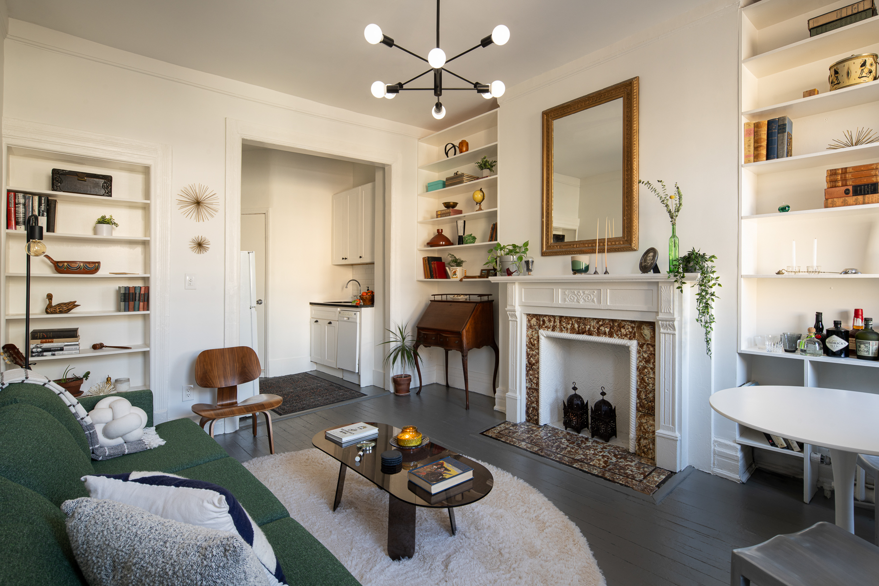 264 West 22nd Street Manhattan, NY 10011 - Photo 2 of 7 a living room with furniture and a fireplace