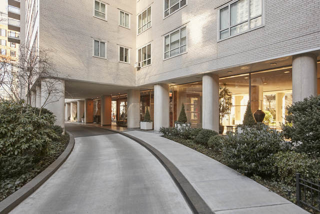 200 East 66th Street, Unit B205 Manhattan, NY 10065 - Photo 13 of 14 a view of a building with potted plants