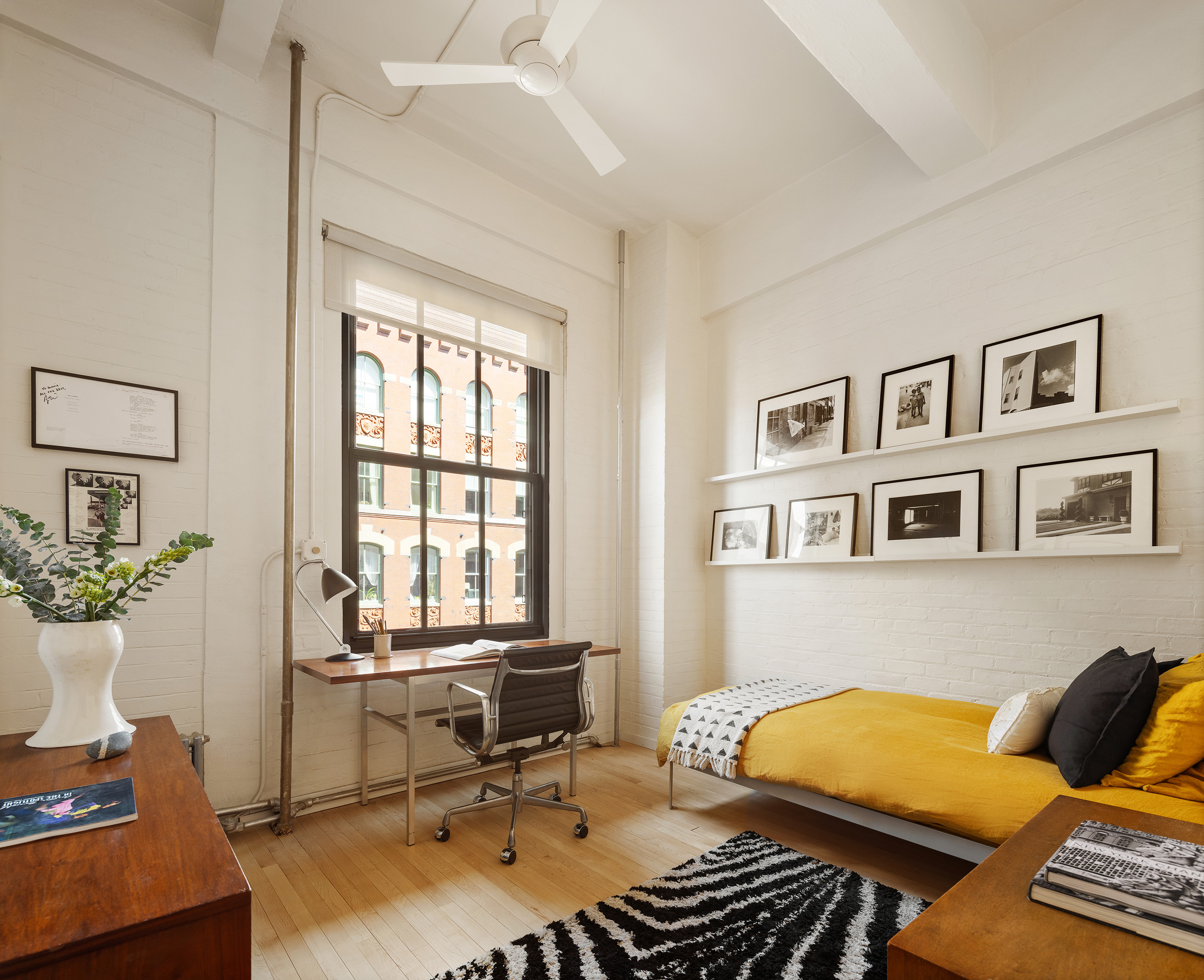 20 Jay Street, Unit 2/3C Manhattan, NY 10013 - Photo 9 of 16 a living room with furniture and a window