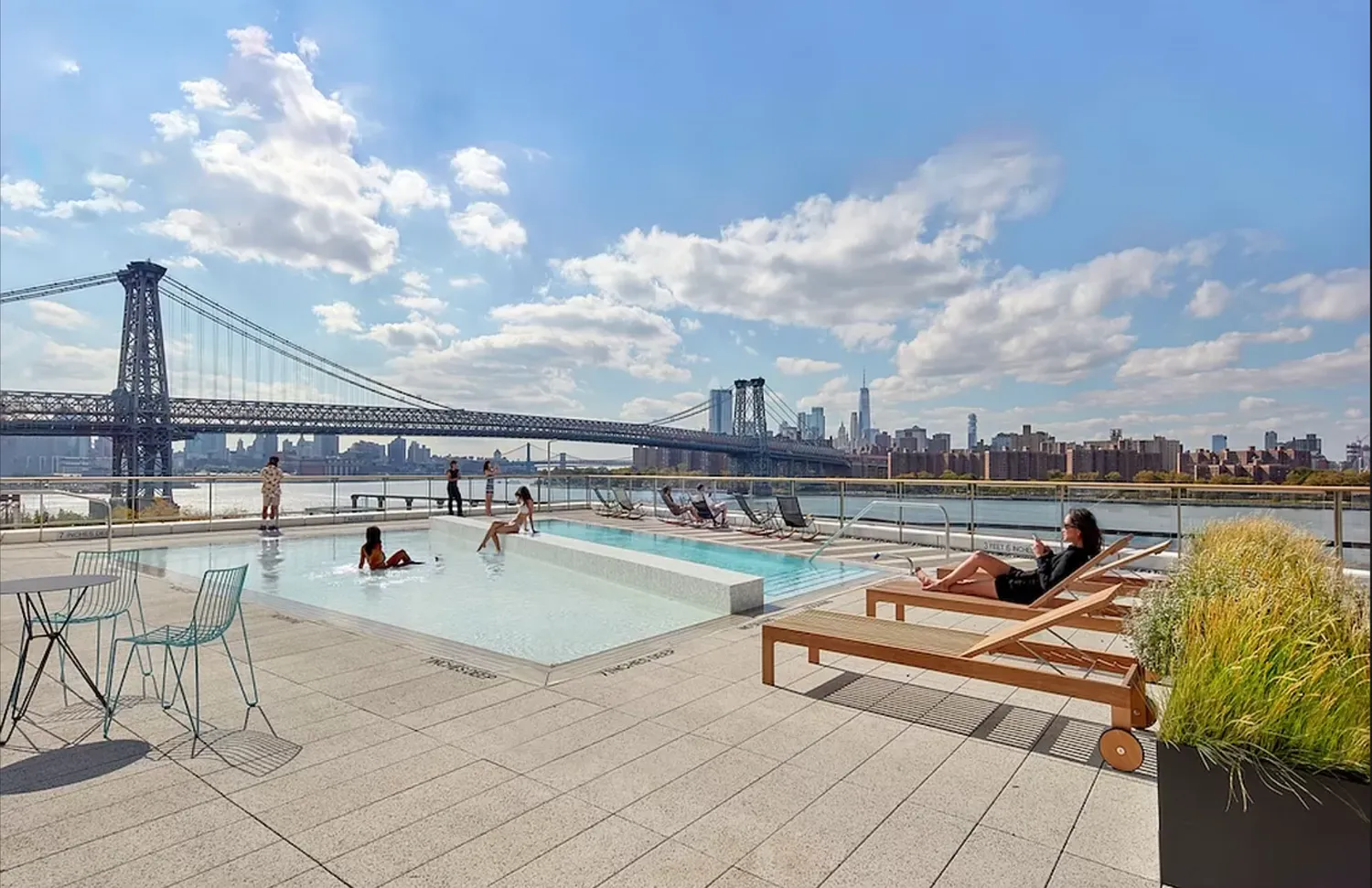 a terrace with outdoor seating and city view