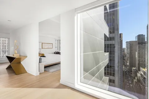 a view of a living room and bathroom