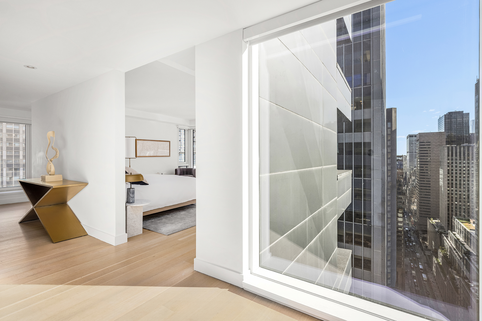 135 West 52nd Street, Unit 40A Manhattan, NY 10019 - Photo 11 of 24 a view of a living room and bathroom