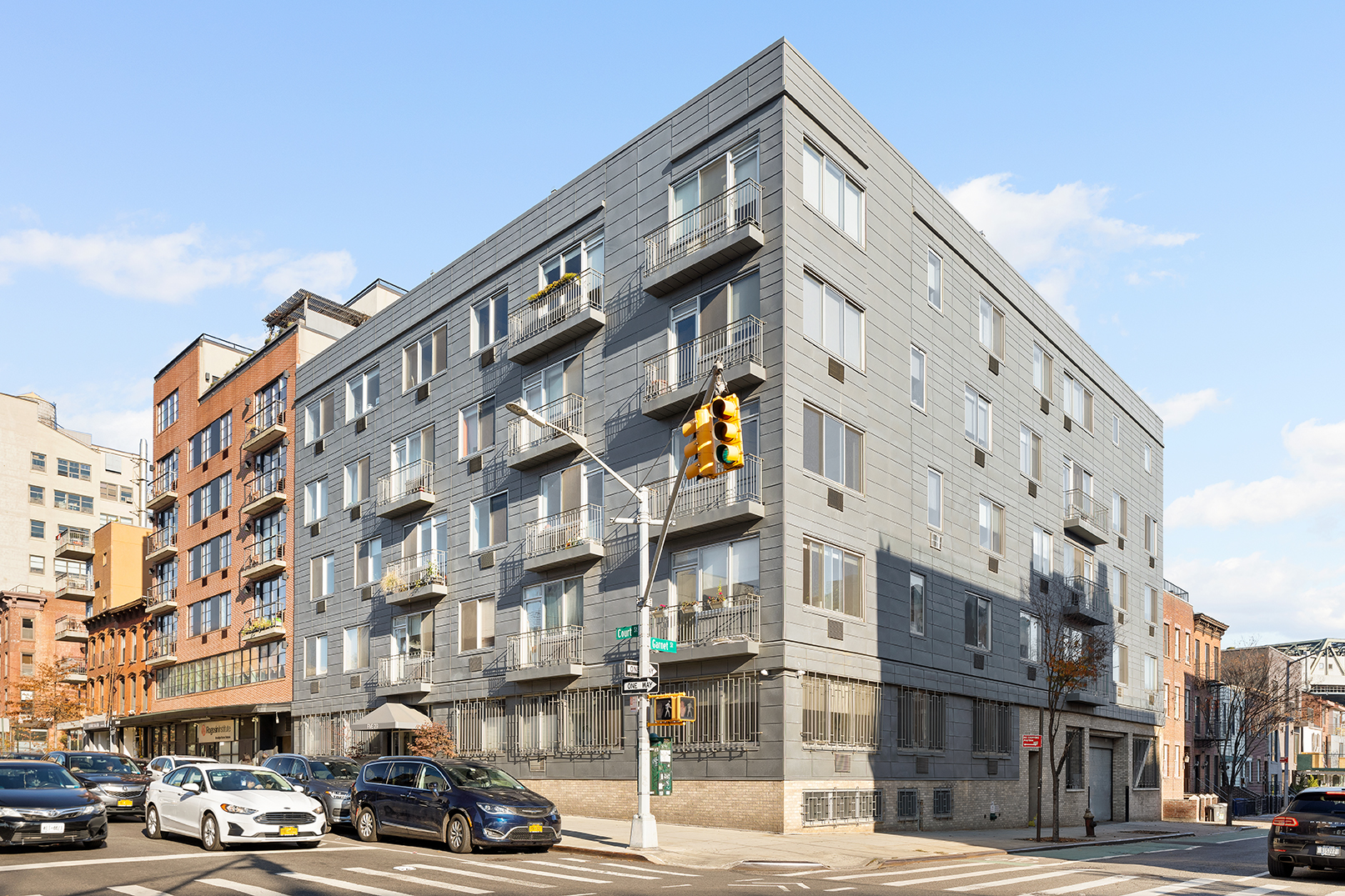 529 Court Street, Unit 204 Brooklyn, NY 11231 - Photo 8 of 9 a couple of cars parked in front of a building