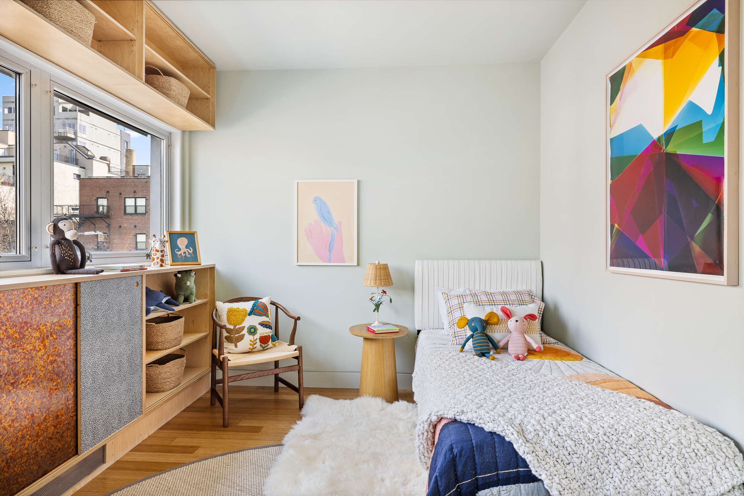 361 Manhattan Avenue, Unit 3AB Brooklyn, NY 11211 - Photo 13 of 21 a bed room with furniture and a baby crib