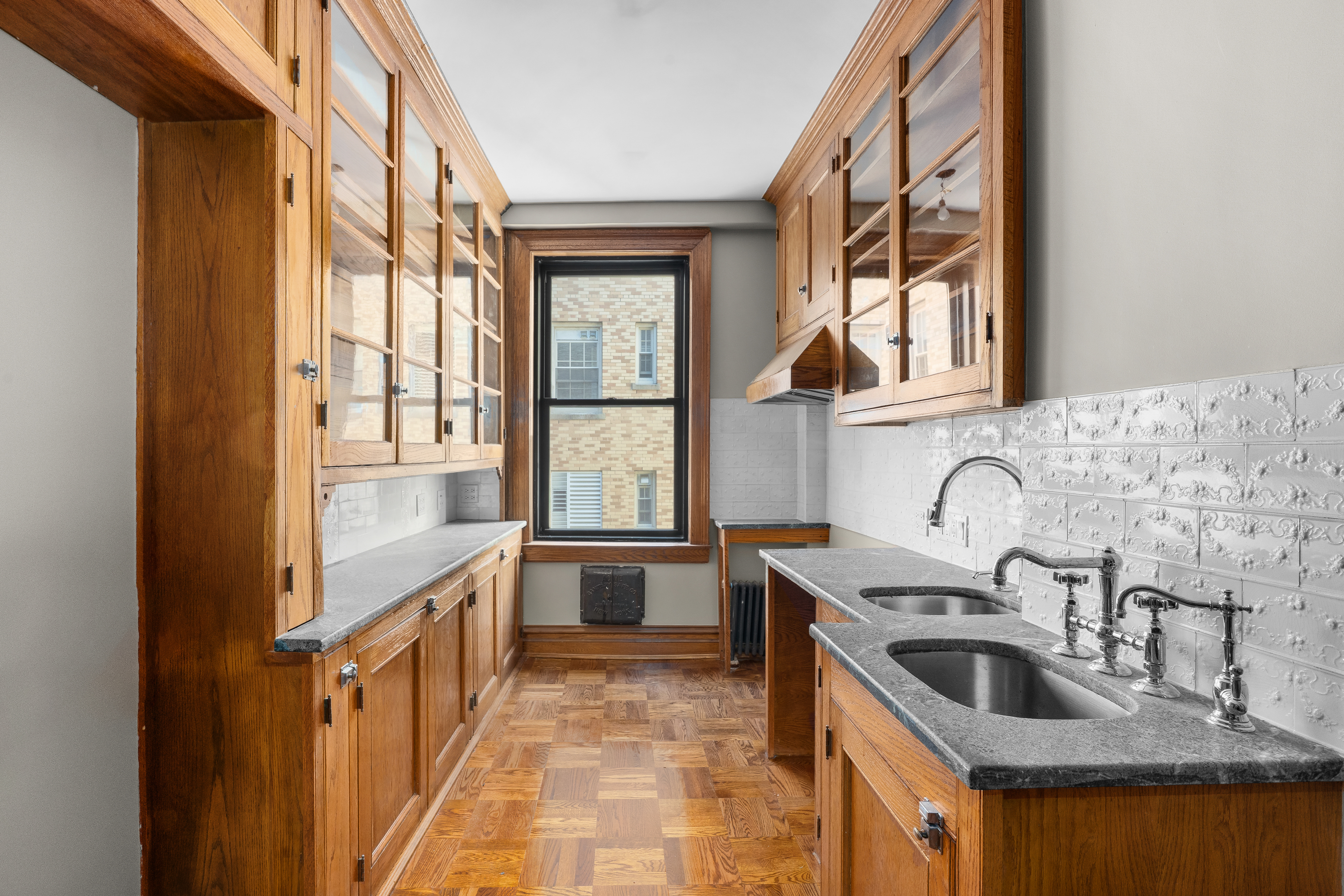 645 West End Avenue, Unit 11D Manhattan, NY 10025 - Photo 3 of 21 a kitchen with granite countertop a sink stove and cabinets