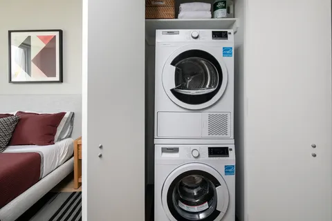 a living room with a couch and a stove top oven