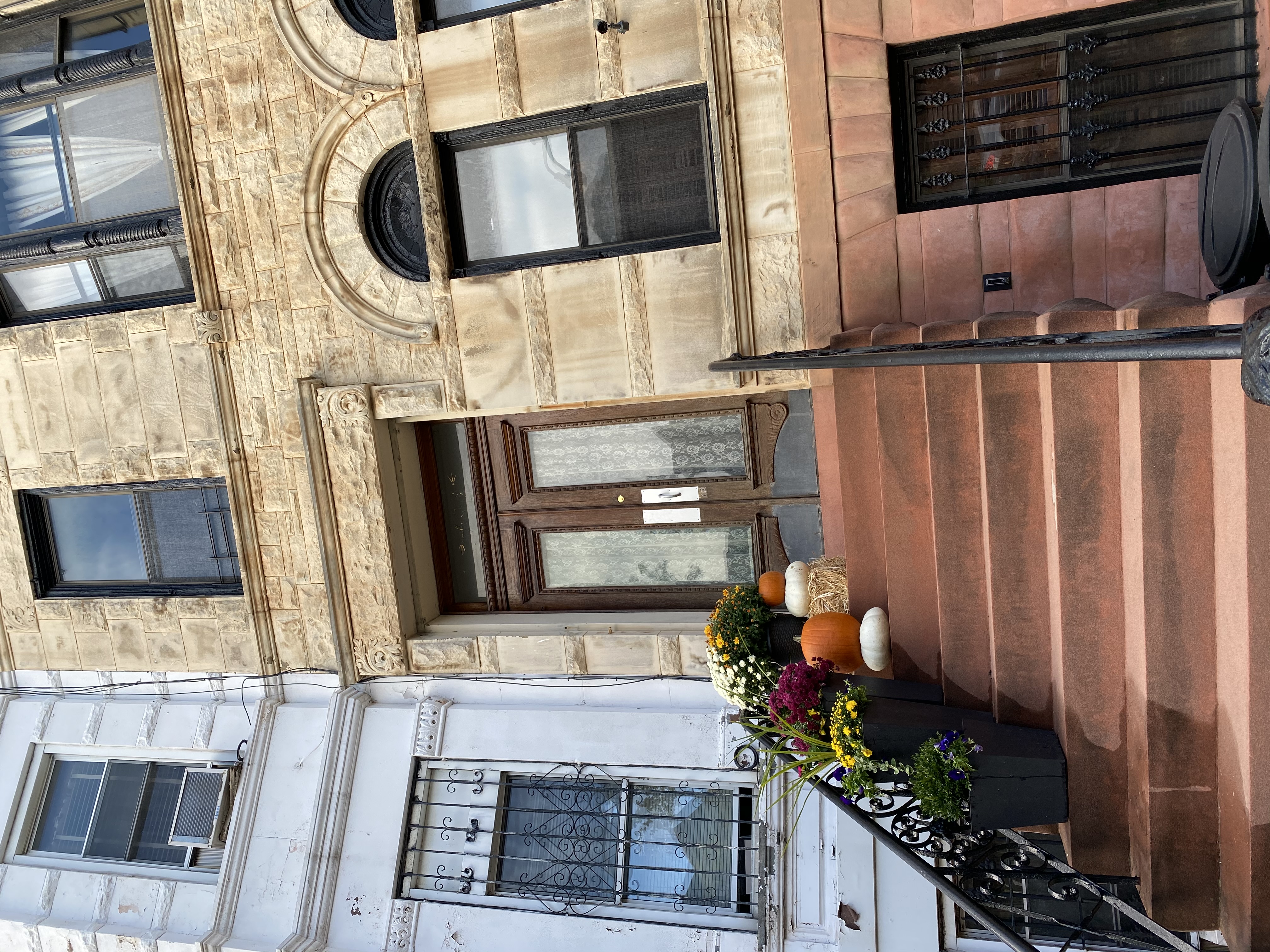 493 Decatur Street, Unit 1 Brooklyn, NY 11233 - Photo 24 of 26 a front view of a house with flower pots