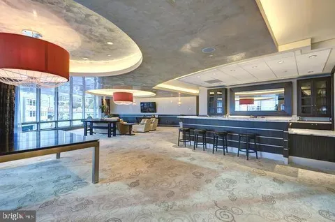 a room with lots of furniture and a wooden floor