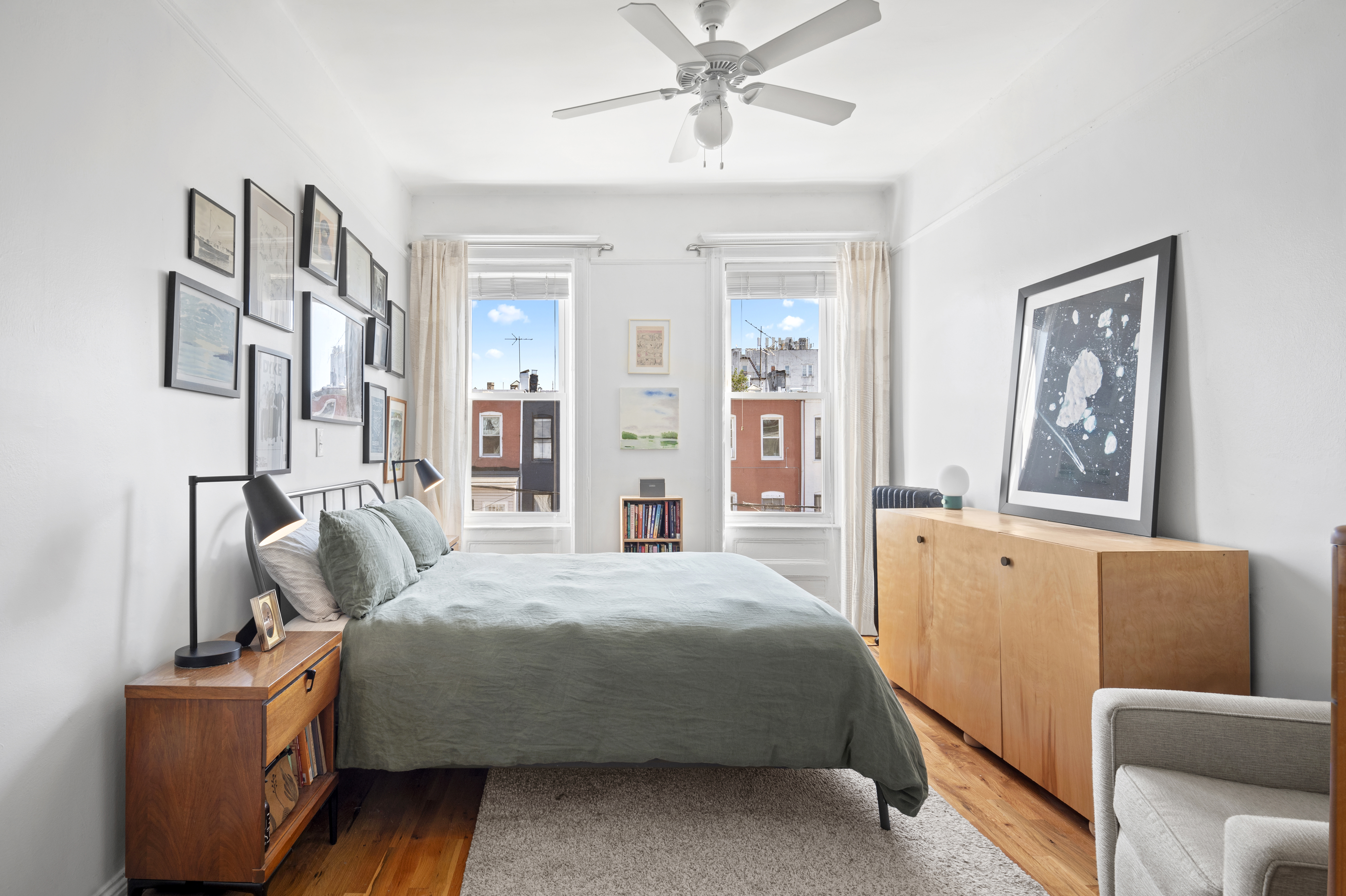 185 East 31st Street Brooklyn, NY 11226 - Photo 21 of 23 a bedroom with a bed and wooden floor