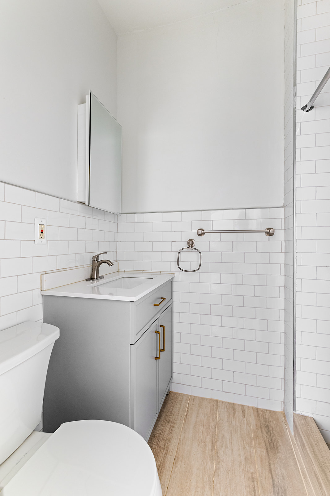 208 Lewis Avenue, Unit 4 Brooklyn, NY 11221 - Photo 6 of 7 a bathroom with a sink a toilet and shower