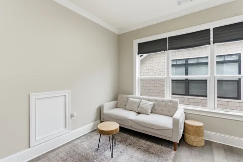 a bedroom with a bed and a ceiling fan