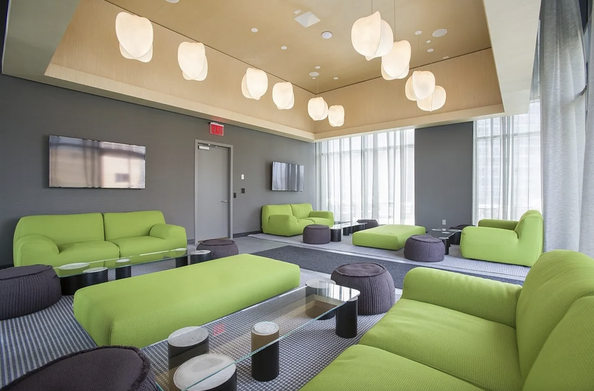 43-25 Hunter Street, Unit 4312W Queens, NY 11101 - Photo 9 of 16 a living room with furniture and a large window