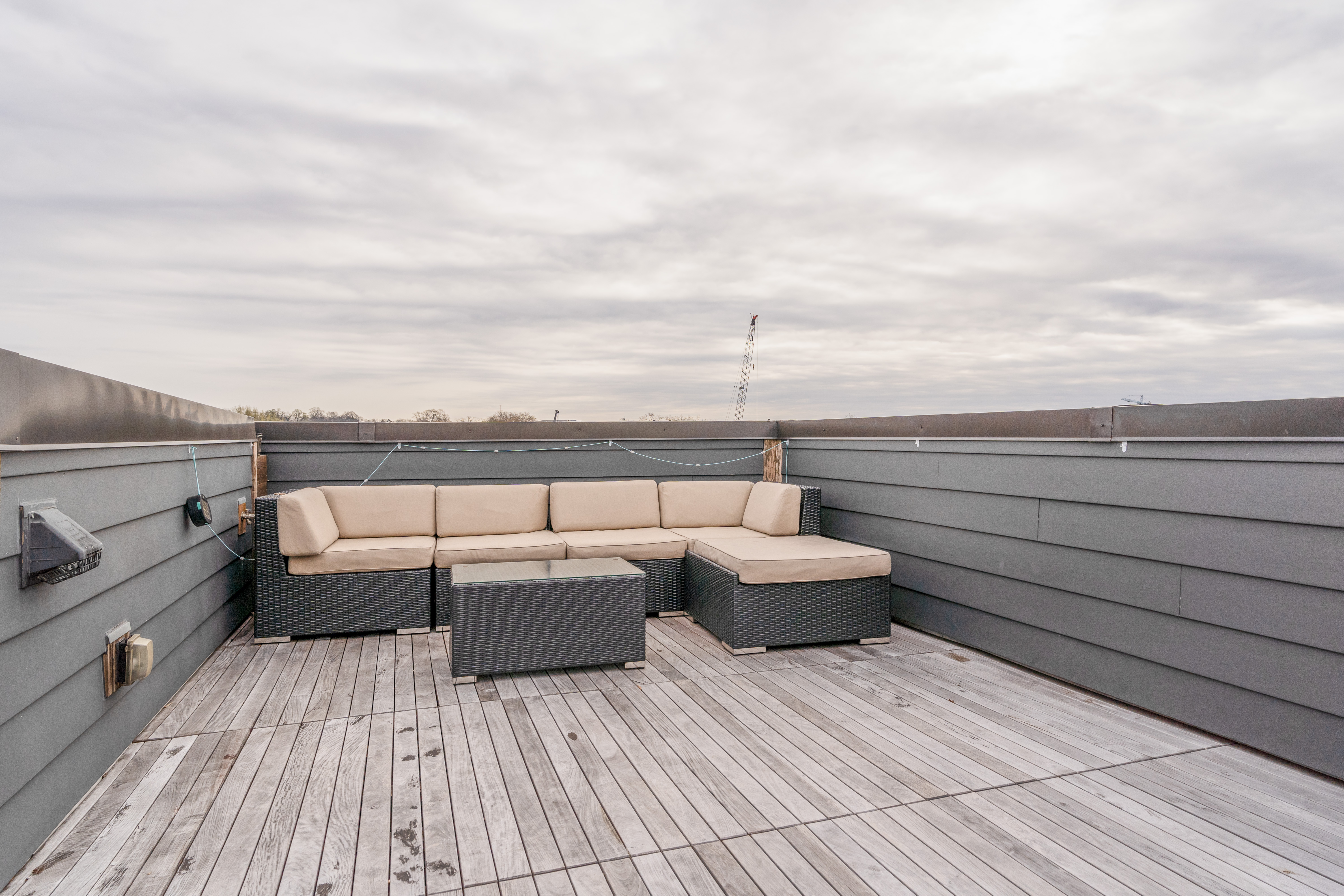 1740 New Jersey Avenue Northwest, Unit 2 Washington, DC 20001 - Photo 33 of 35 a view of roof deck with couches and wooden floor