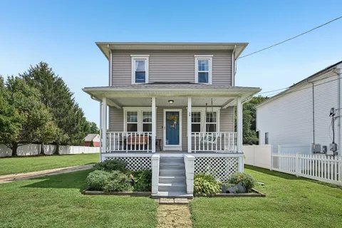 front view of a house with a yard