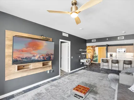 a living room with furniture and a large window