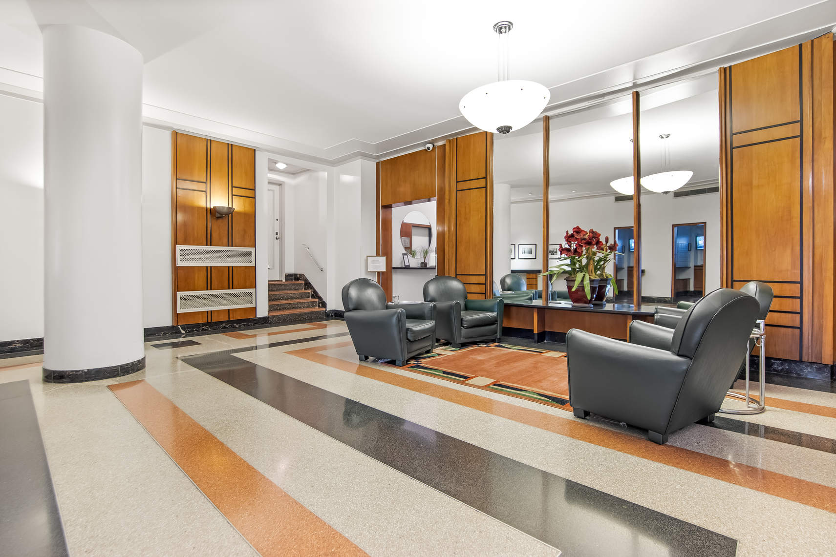 565 West End Avenue, Unit 3C Manhattan, NY 10024 - Photo 14 of 15 a living room with furniture windows and a flat screen tv