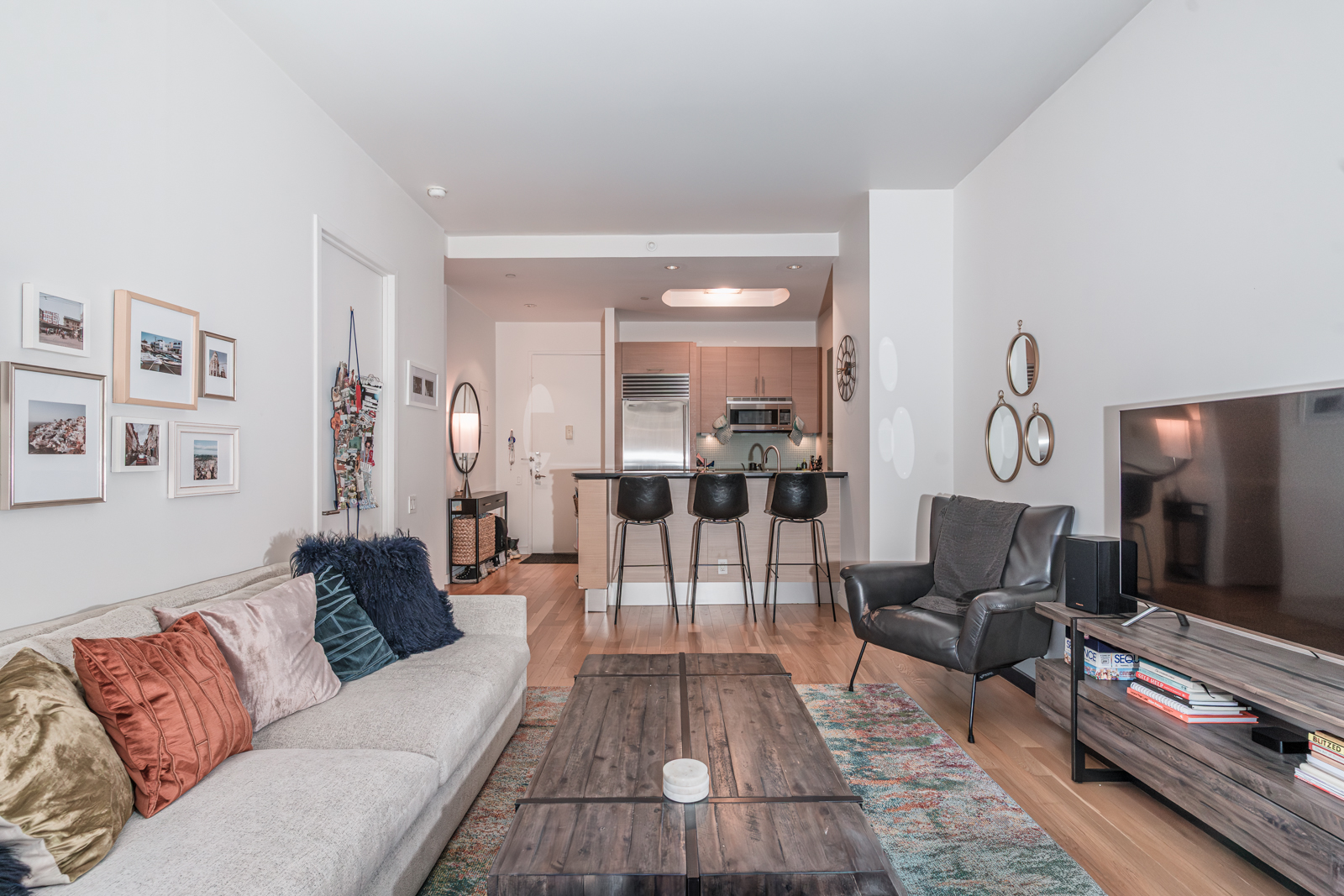 325 5th Avenue, Unit 14E Manhattan, NY 10016 - Photo 3 of 19 a living room with furniture and a flat screen tv