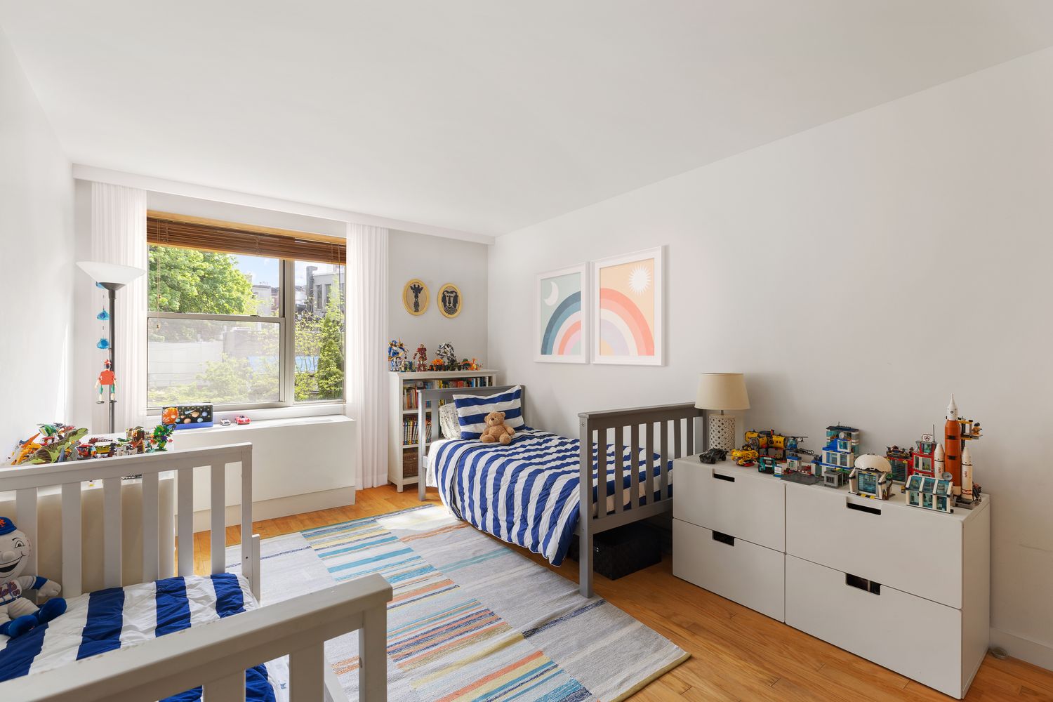 a bedroom with furniture and a window