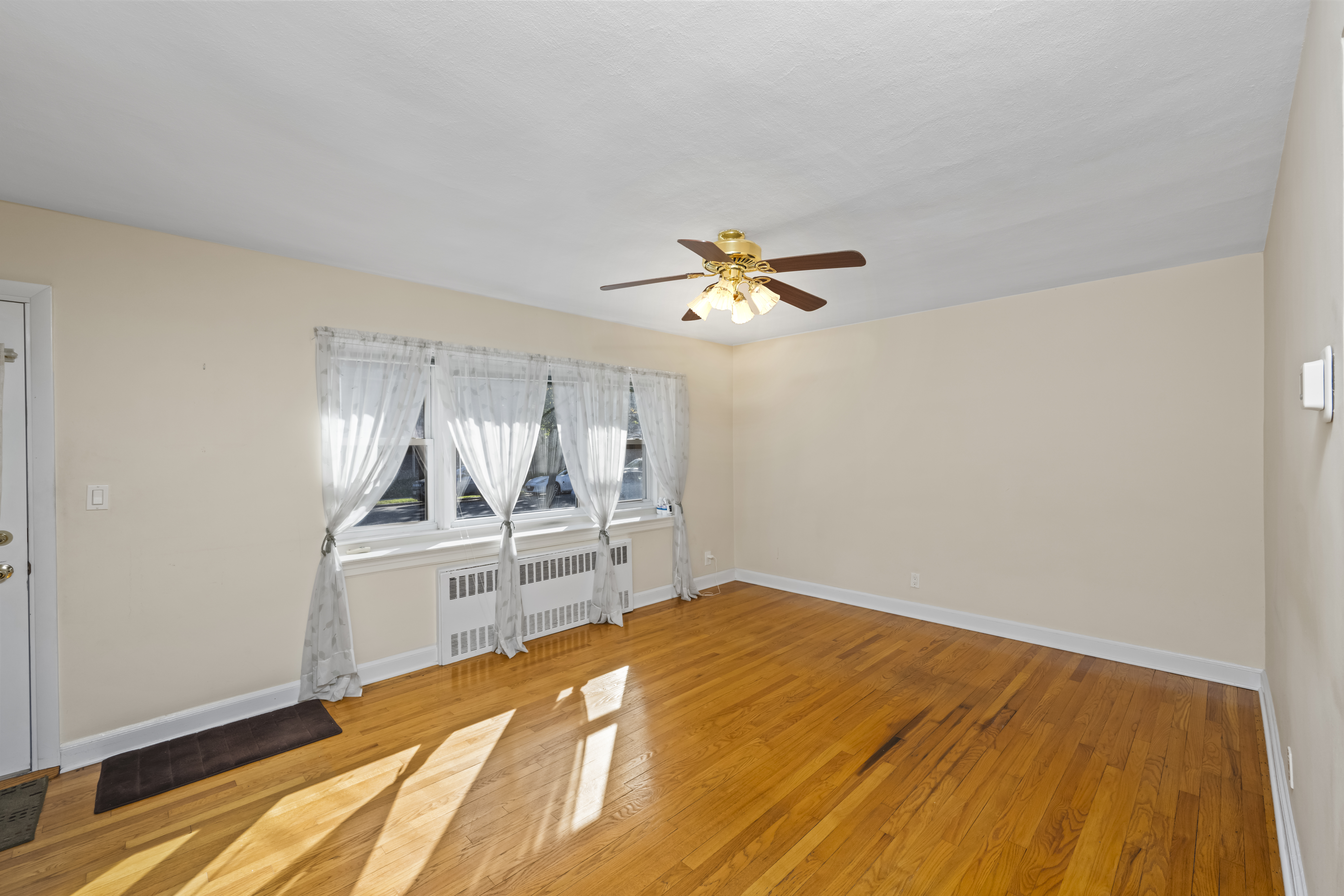 522 Stewart Avenue Staten Island, NY 10314 - Photo 8 of 33 a bedroom with a bed and a chandelier