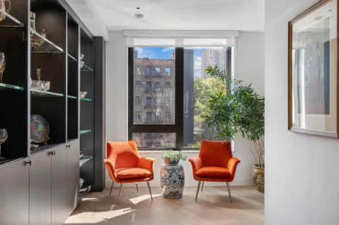 a outdoor living room with furniture and a potted plant