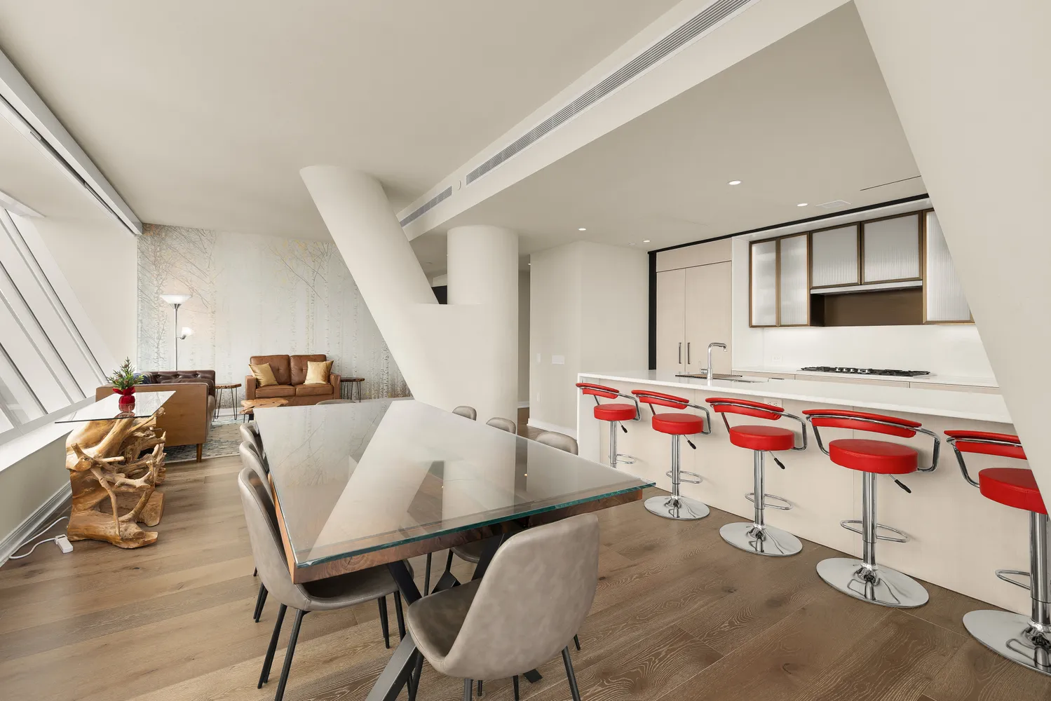 a kitchen with stainless steel appliances a sink and a refrigerator