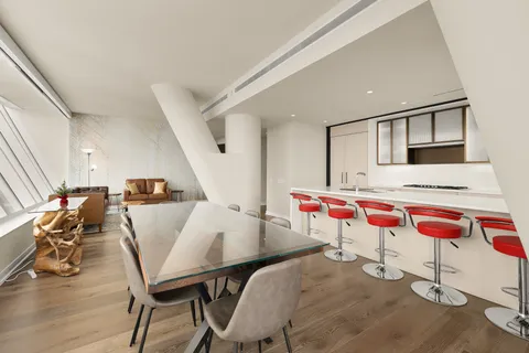 a kitchen with stainless steel appliances a sink and a refrigerator
