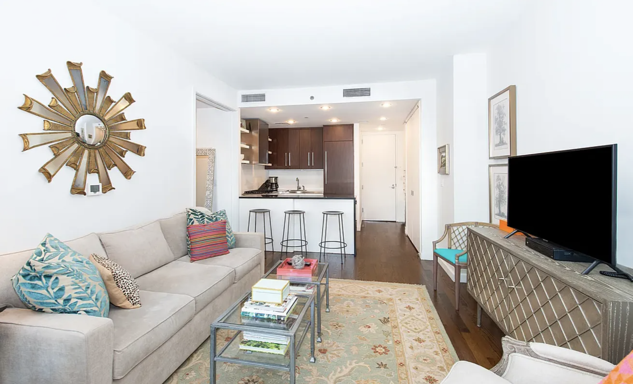 133 West 22nd Street, Unit 7H Manhattan, NY 10011 - Photo 19 of 22 a living room with furniture and a flat screen tv