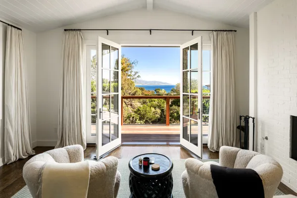 a bathroom with a granite countertop sink and a window