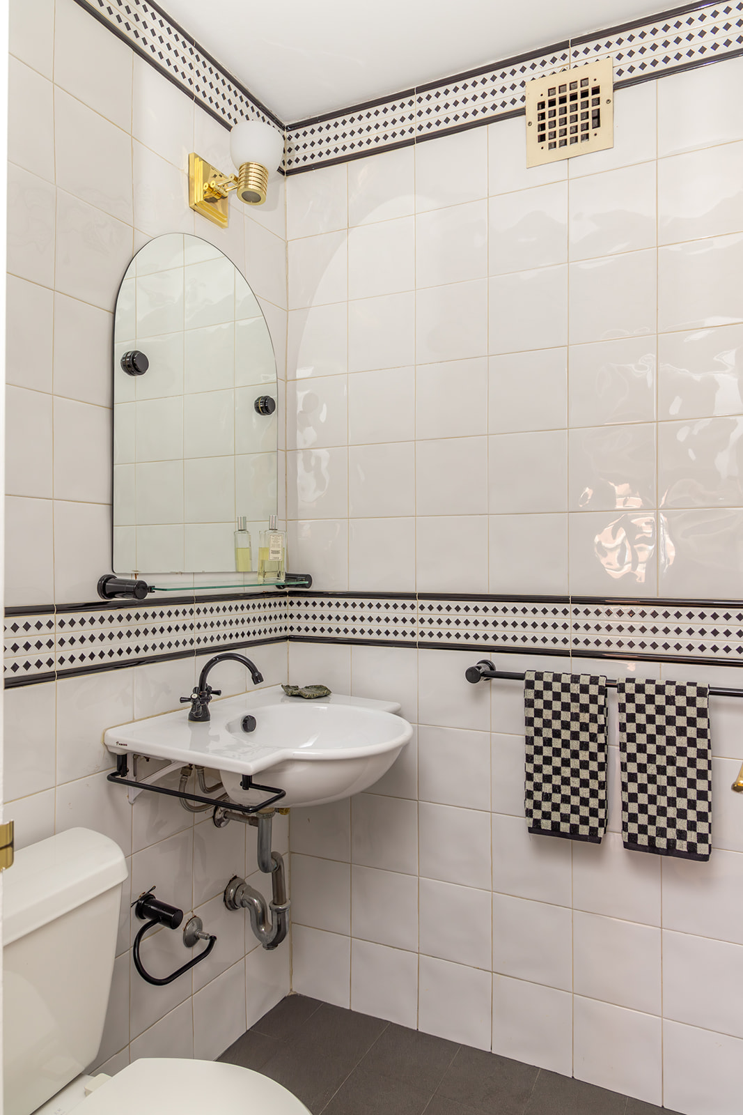 132 East 35th Street, Unit 7H Manhattan, NY 10016 - Photo 16 of 25 a bathroom with a sink toilet and shower