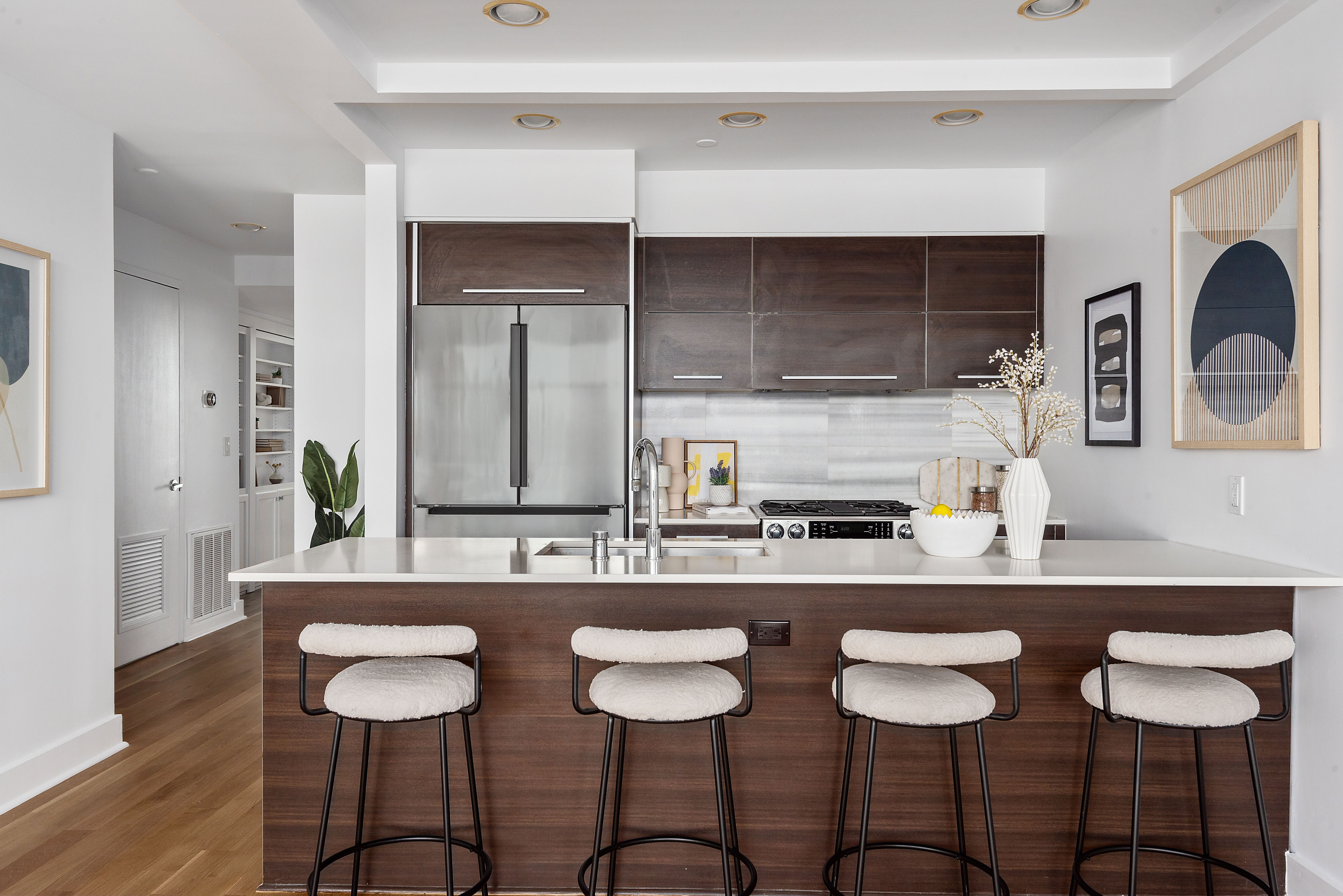 460 Manhattan Avenue, Unit PHB Brooklyn, NY 11222 - Photo 6 of 16 a kitchen with a dining table chairs cabinets and wooden floor