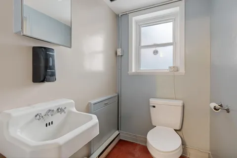 a room with chairs and closet