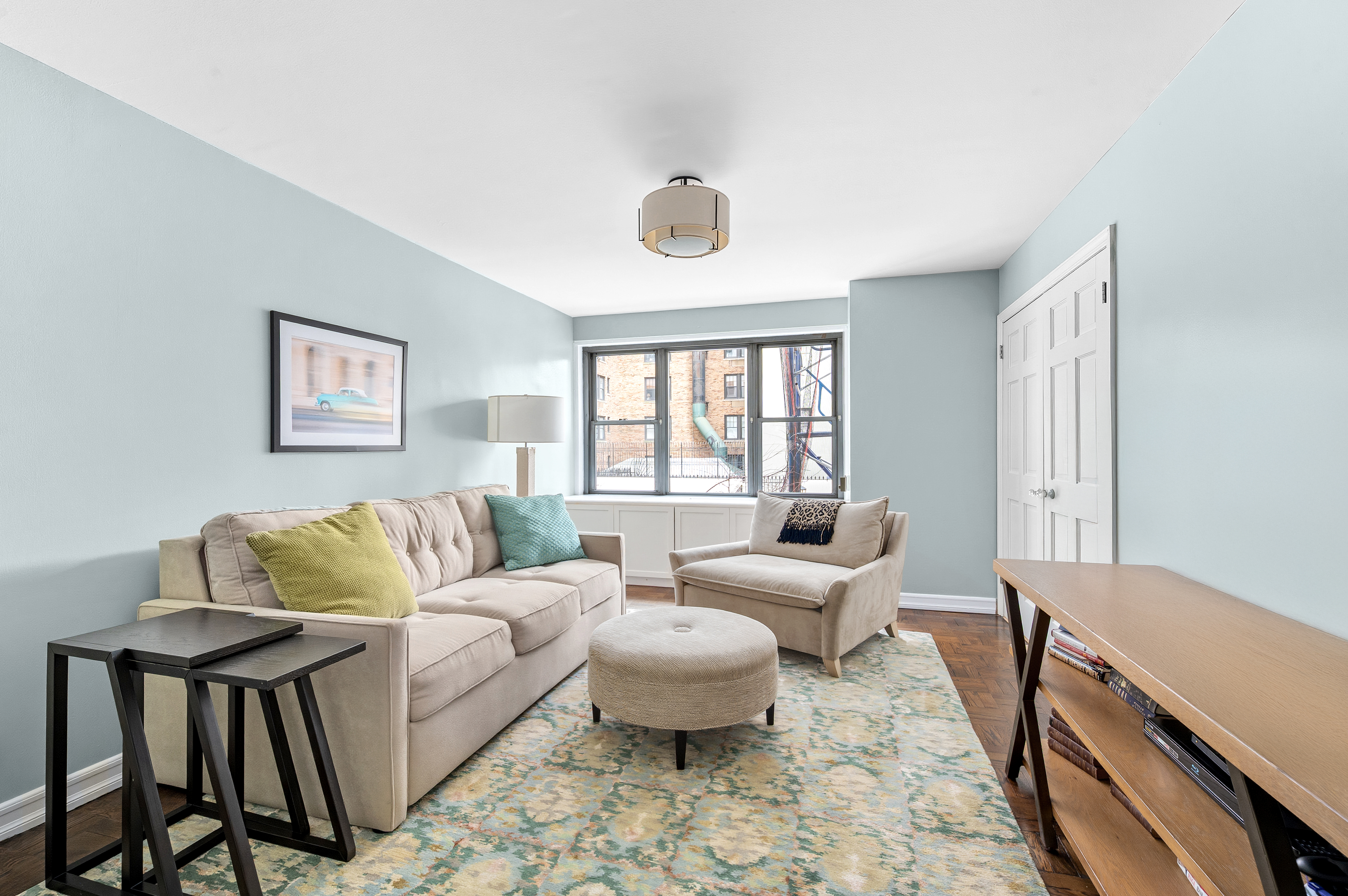 15 West 72nd Street, Unit 2C Manhattan, NY 10023 - Photo 7 of 9 a living room with furniture and a window