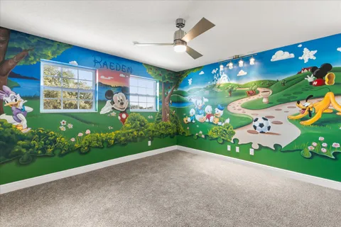 a view of a patio with a table and chairs