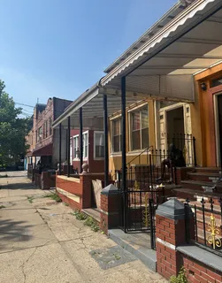 a view of a house with outdoor seating