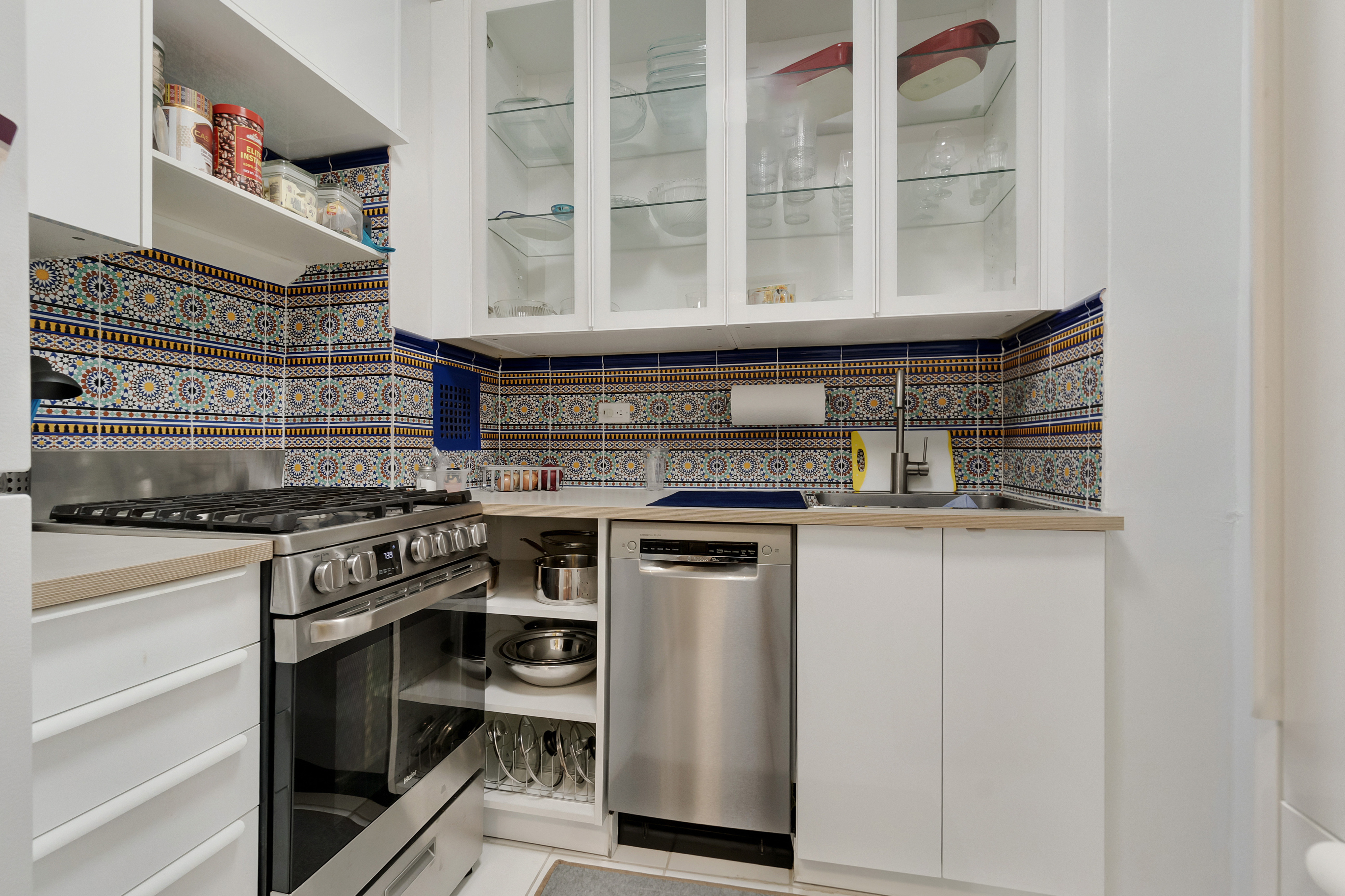 1170 Ocean Parkway, Unit 7A Brooklyn, NY 11230 - Photo 7 of 13 a kitchen with stainless steel appliances granite countertop a stove and a sink