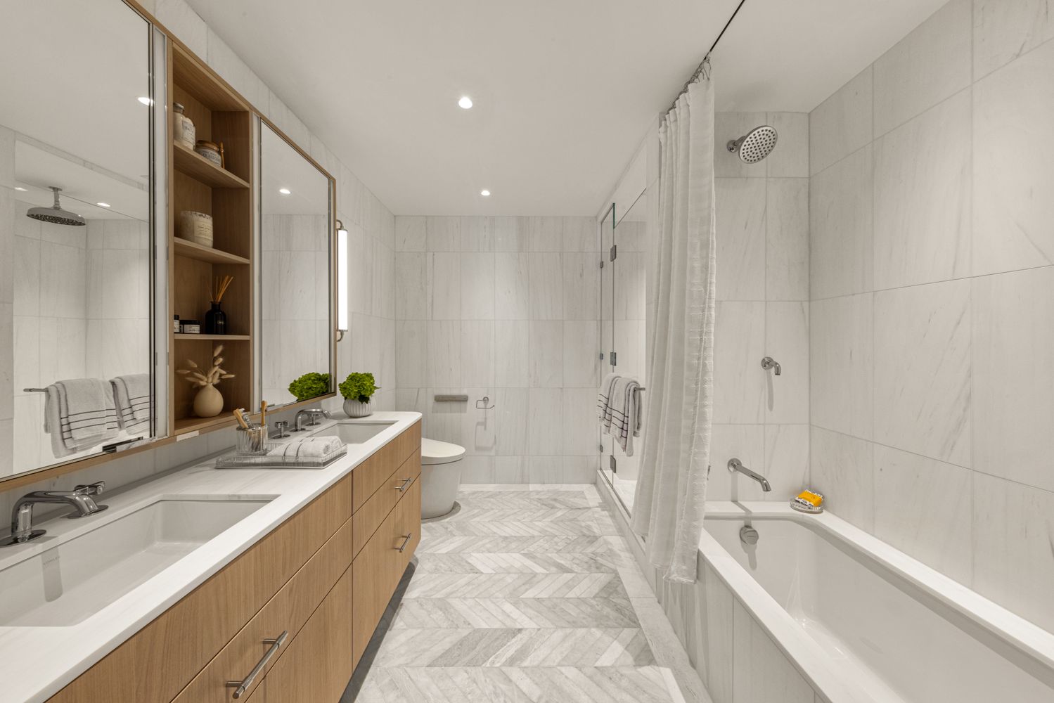 a bathroom with a granite countertop tub sink and mirror