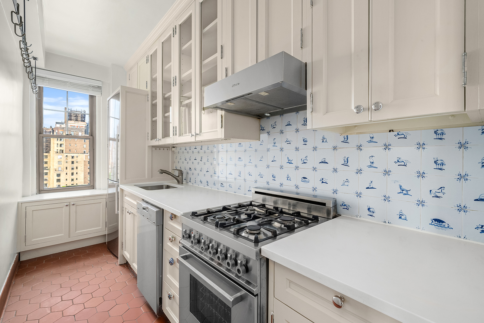 45 Christopher Street, Unit 12/14F Manhattan, NY 10014 - Photo 3 of 18 a kitchen with a stove a sink and a window