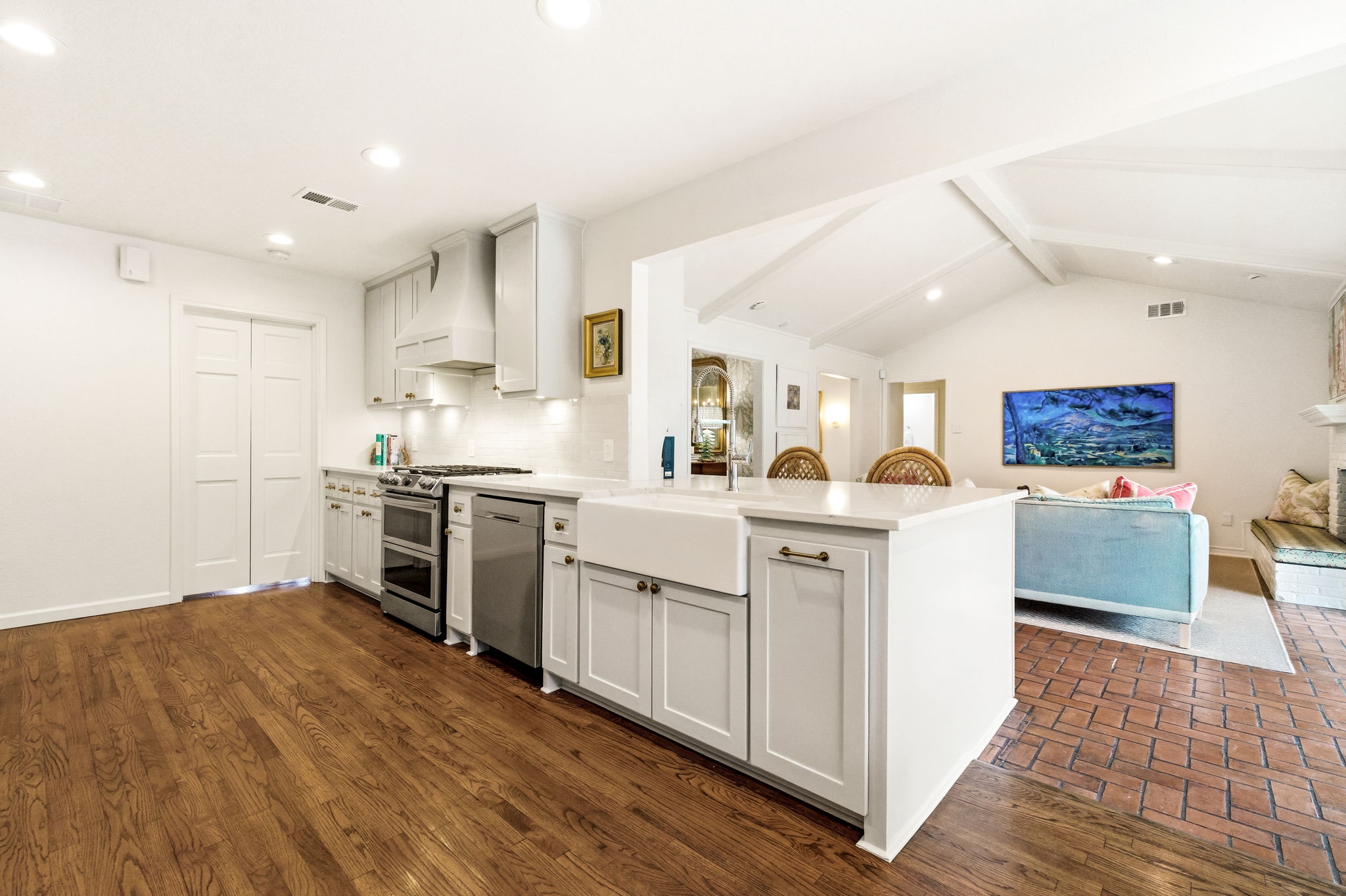 5765 Stonegate Road Dallas, TX 75209 - Photo 13 of 37 a kitchen with white cabinets and stainless steel appliances
