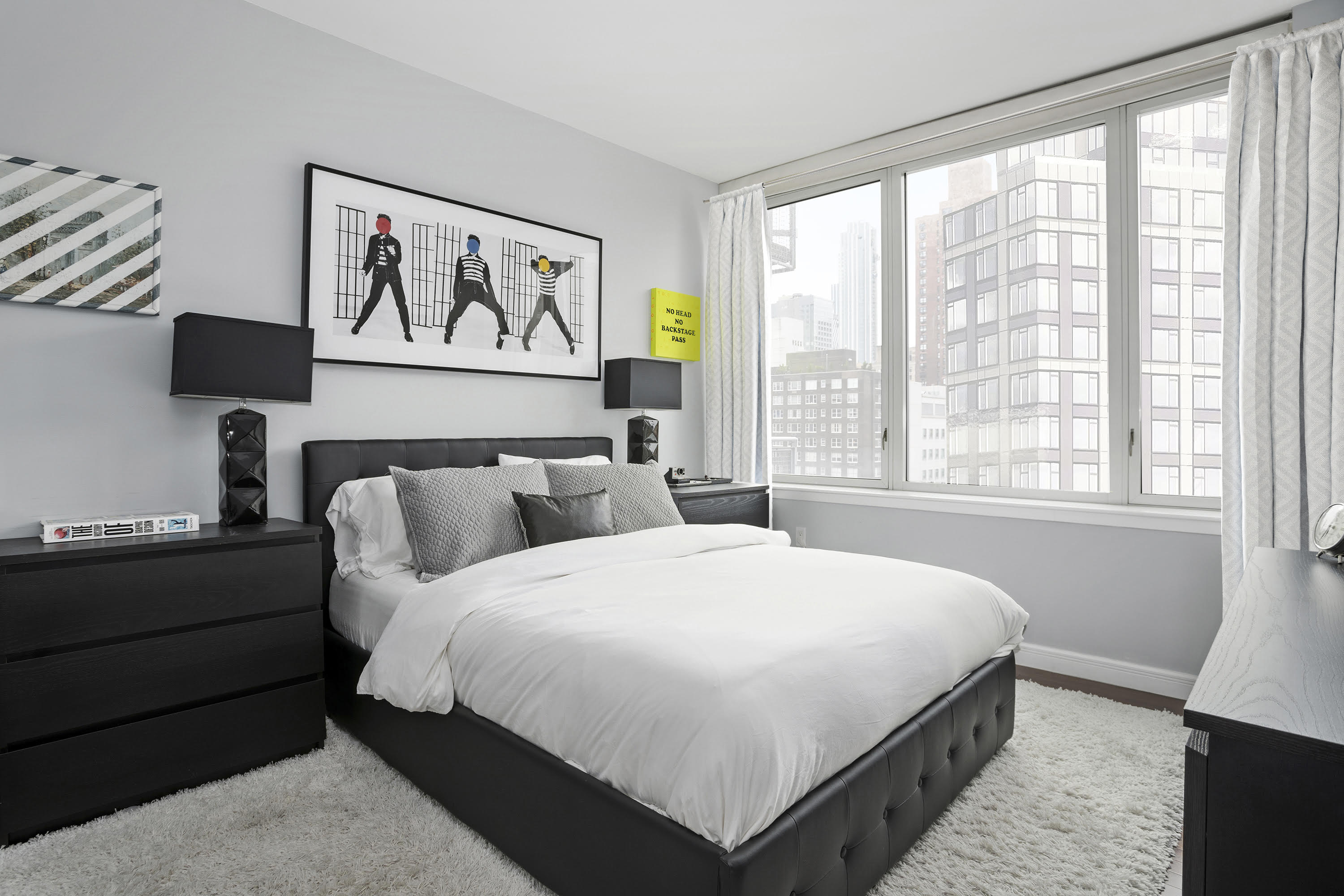 225 East 34th Street, Unit 19C Manhattan, NY 10016 - Photo 5 of 18 a bedroom with a bed and a window