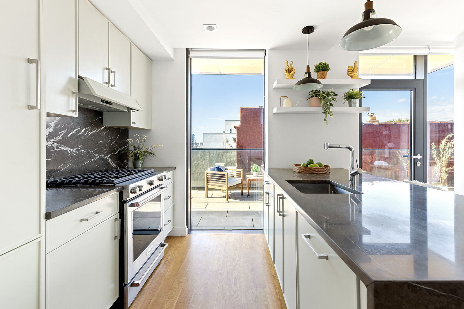 554 4th Avenue, Unit 4D Brooklyn, NY 11215 - Photo 4 of 11 a kitchen with stainless steel appliances granite countertop a sink stove and refrigerator