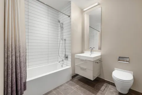 a bathroom with a sink toilet and bathtub