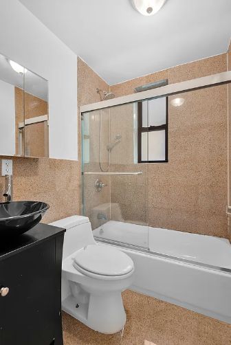 370 Columbus Avenue, Unit 2J Manhattan, NY 10024 - Photo 5 of 9 a bathroom with a toilet a sink and shower