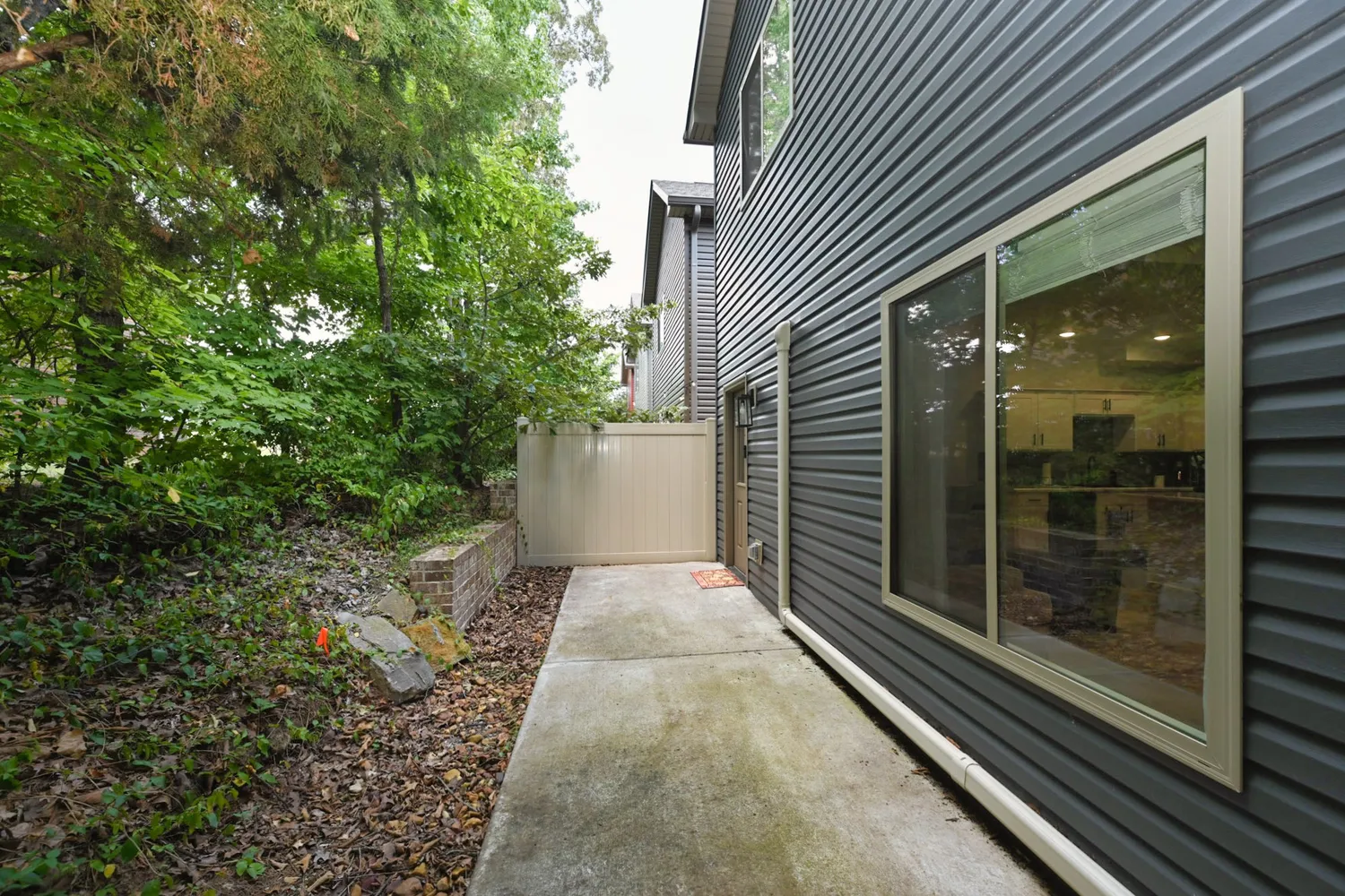 a view of a pathway both side of house