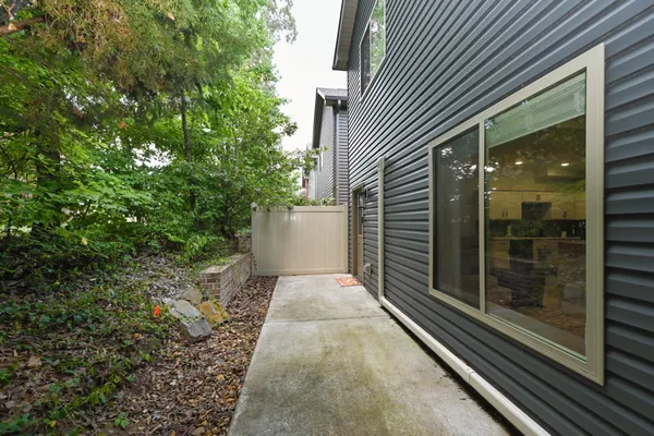 a view of a pathway both side of house