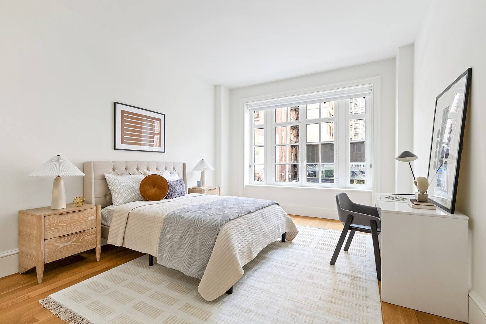 1045 Madison Avenue, Unit 3B Manhattan, NY 10075 - Photo 10 of 14 a bedroom with a bed and a large window