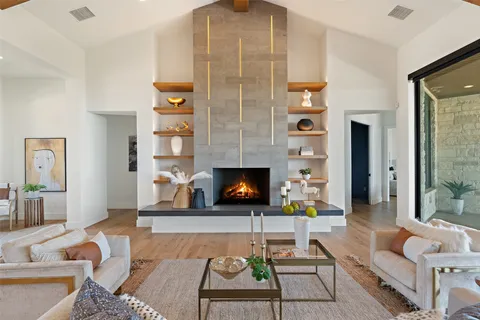 a living room with furniture and a fireplace